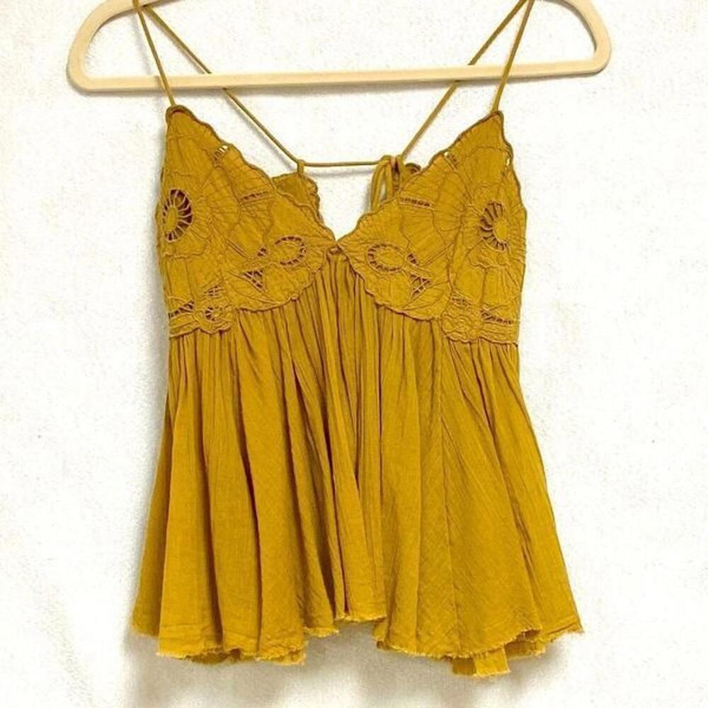 Free People lace up babydoll cami top. Size xs but can fit up to medium